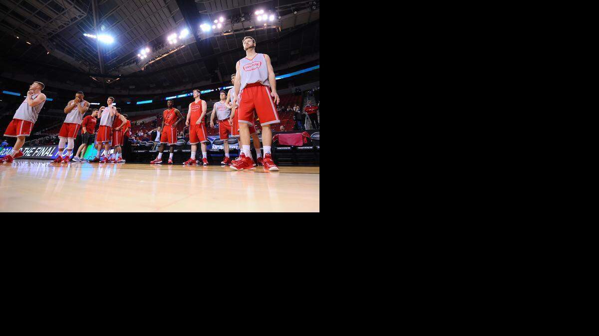 
The Davidson Wildcats prepare to take the court during open practice session in the 2015 NCAA Men's Basketball Championships at KeyArena on Thursday, March 19, 2015 in Seattle, Wash.
