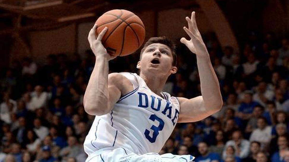 
Duke guard Grayson Allen (3) goes up and over Wake Forest guard Mitchell Wilbekin (10) in the first half to score two of his 19 points. Duke played Wake Forest University Wednesday, March 4, 2015 at Cameron Indoor Stadium in DurhamC.
