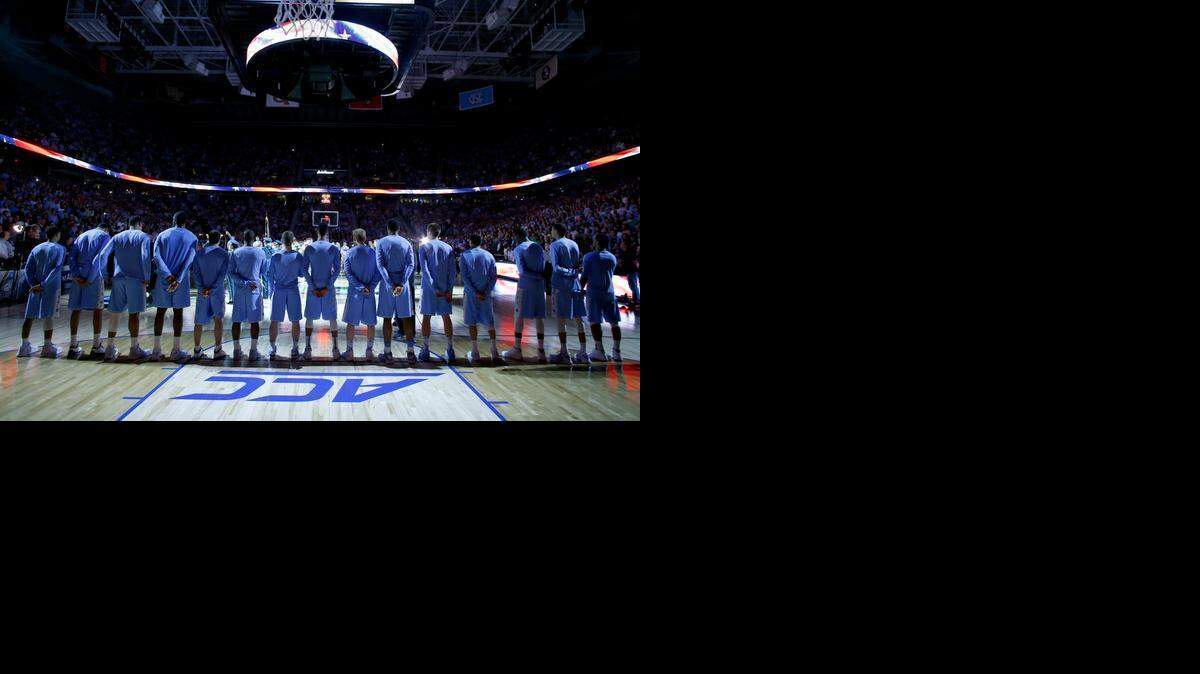 
UNC players line up for the playing of the National Anthem before North Carolina's game against Notre Dame in the finals of the 2015 New York Life ACC Tournament at the Greensboro Coliseum in Greensboro, N.C., Saturday, March 14, 2015. The tournament, which moves next year to Washington, D.C. and then to Brooklyn in 2017, is about to be unmoored from North Carolina for the longest stretch in history.
