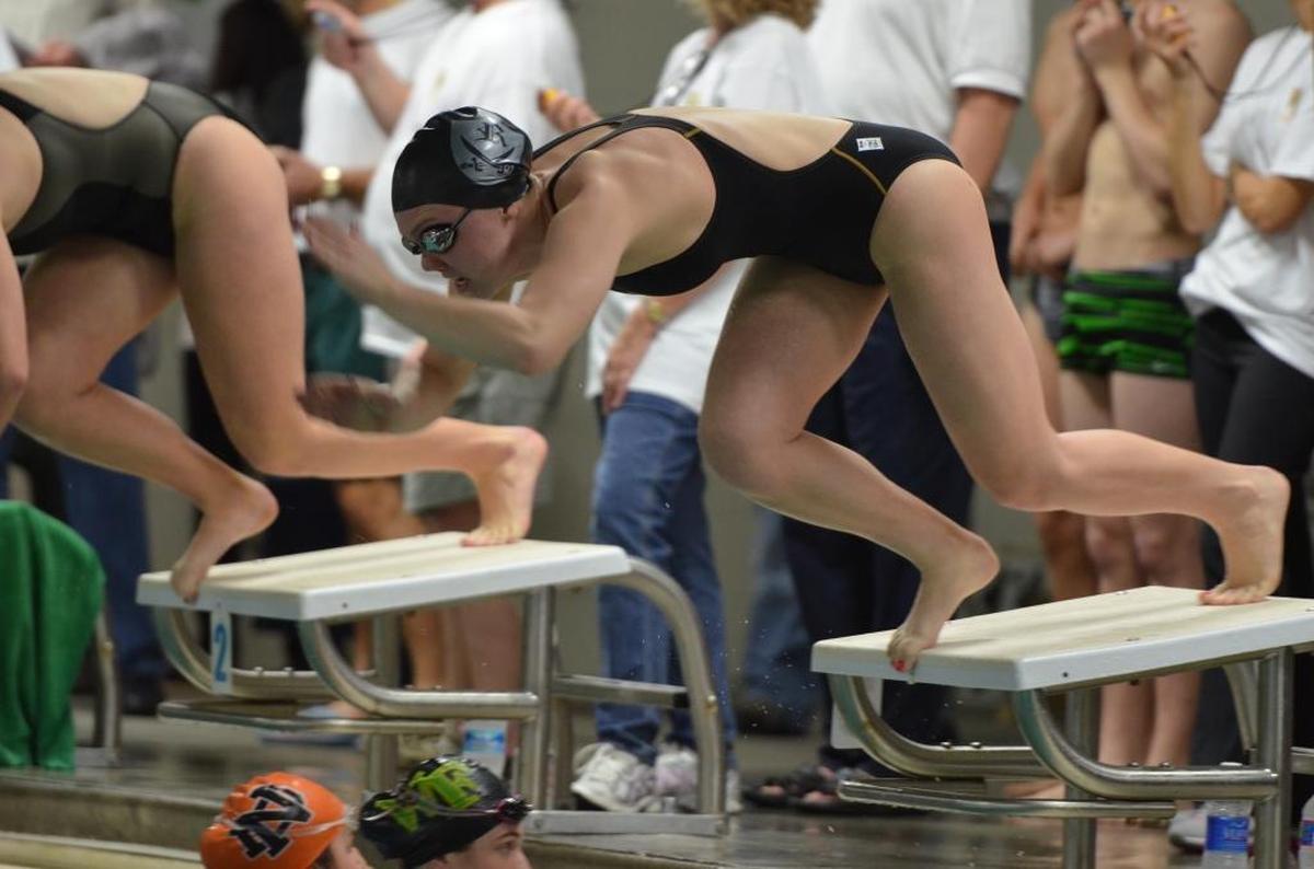 Alexandra Marshall comes off the starting blocks at a meet during her junior year at Winston-Salem’s Reagan High School; she earned all-conference, all-state and All-American honors in both her junior and senior years.