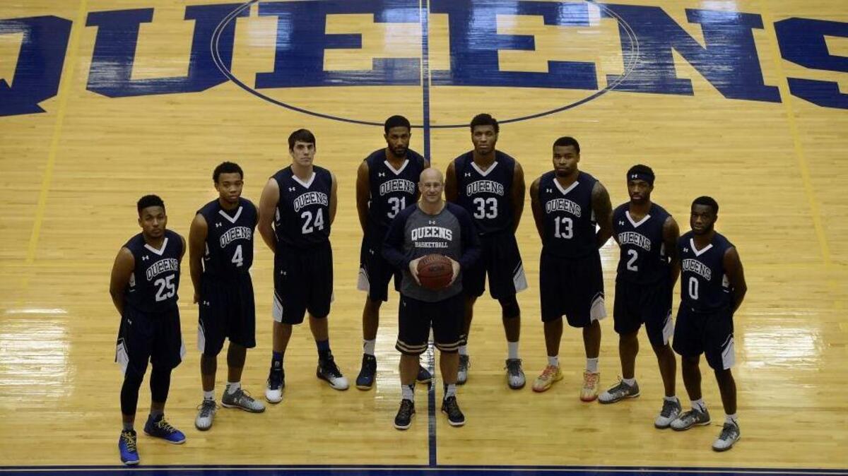 Members of the No.4-ranked Queens’ men’s basketball team, including coach Bart Lundy (front): Darryl White Jr (25); Mike Davis Jr (4); Tate Small (24); Jared Hendryx (31); Todd Withers (33); Daniel Camps (13); Jalin Alexander (2); and Ike Agusi (0).