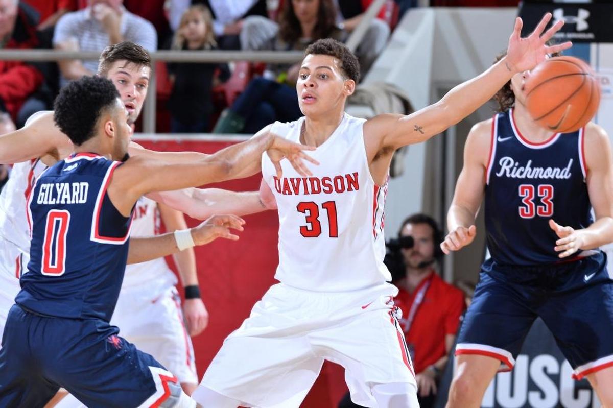 Davidson freshman Kellan Grady (31) defends against Richmond's Jacob Gilyard (0) late in the first half of Sunday’s A-10 basketball game at Belk Arena. Grady finished with 14 points as the Wildcats lost 66-63.