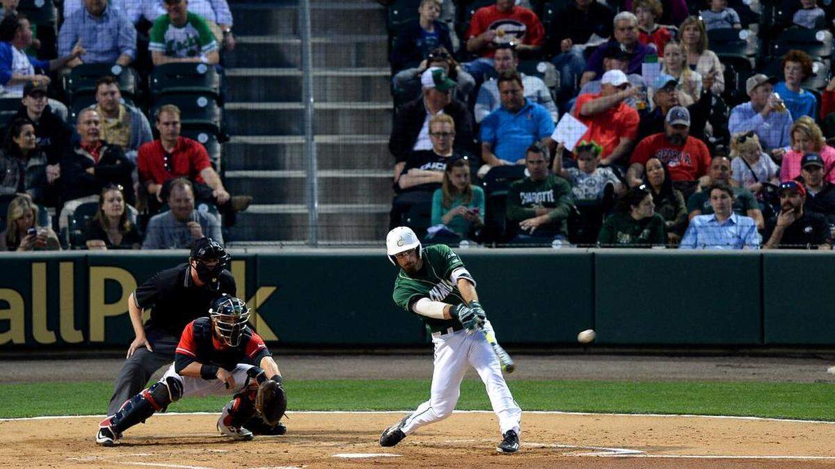 Charlotte 49ers batter Drew Ober follows through on his hit for a single during nonconference college baseball action vs the Georgia Bulldogs on Tuesday, March 8, 2016 at BB&T BallPark in Charlotte, NC.