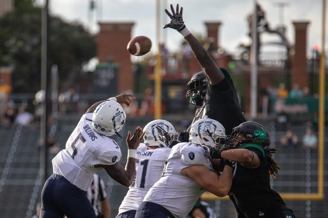 Charlotte 49ers defensive tackle Timmy Horne tips a pass thrown by Old Dominion’s Steven Williams in Thursday’s Conference USA opener at Richardson Stadium. Charlotte won 28-25.