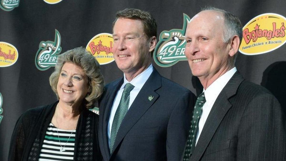 Charlotte 49ers head basketball coach Mark Price, center, poses with director of athletics Judy Rose, left, and UNC Charlotte chancellor Phillip Dubois. Rose’s two most prominent programs, men’s basketball and football, have struggled to win consistently.