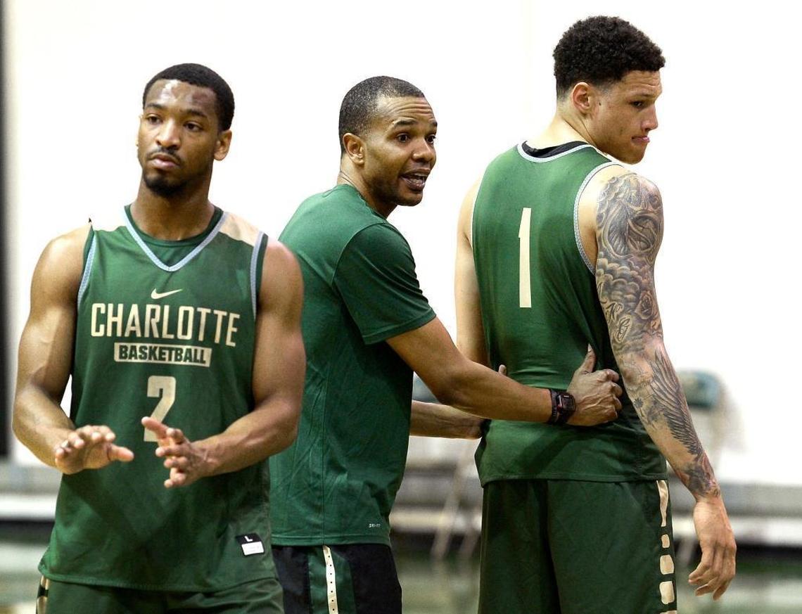 Charlotte 49ers head basketball coach Ron Sanchez, center, is charged with one of college basketball’s toughest tasks: resurrecting the 49ers’ once-proud program. “I was really comfortable at Virginia. But I felt called to get uncomfortable.”