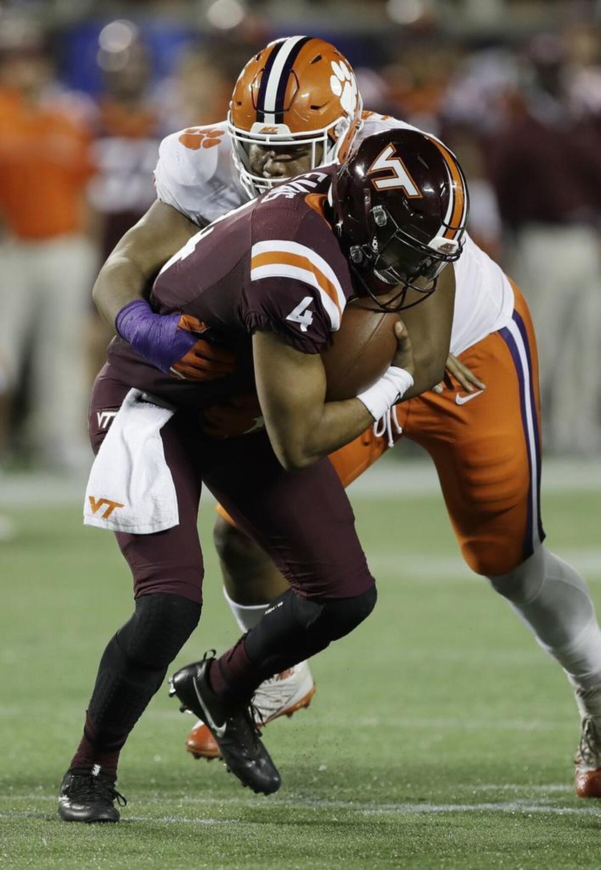 Clemson defensive tackle Dexter Lawrence (90) sacks Virginia Tech quarterback Jerod Evans (4) during last season’s ACC Championship game in Orlando. Fla. That was one of 6 1/2 sacks Lawrence recorded as a freshman in the Tigers’ run to the national championship.