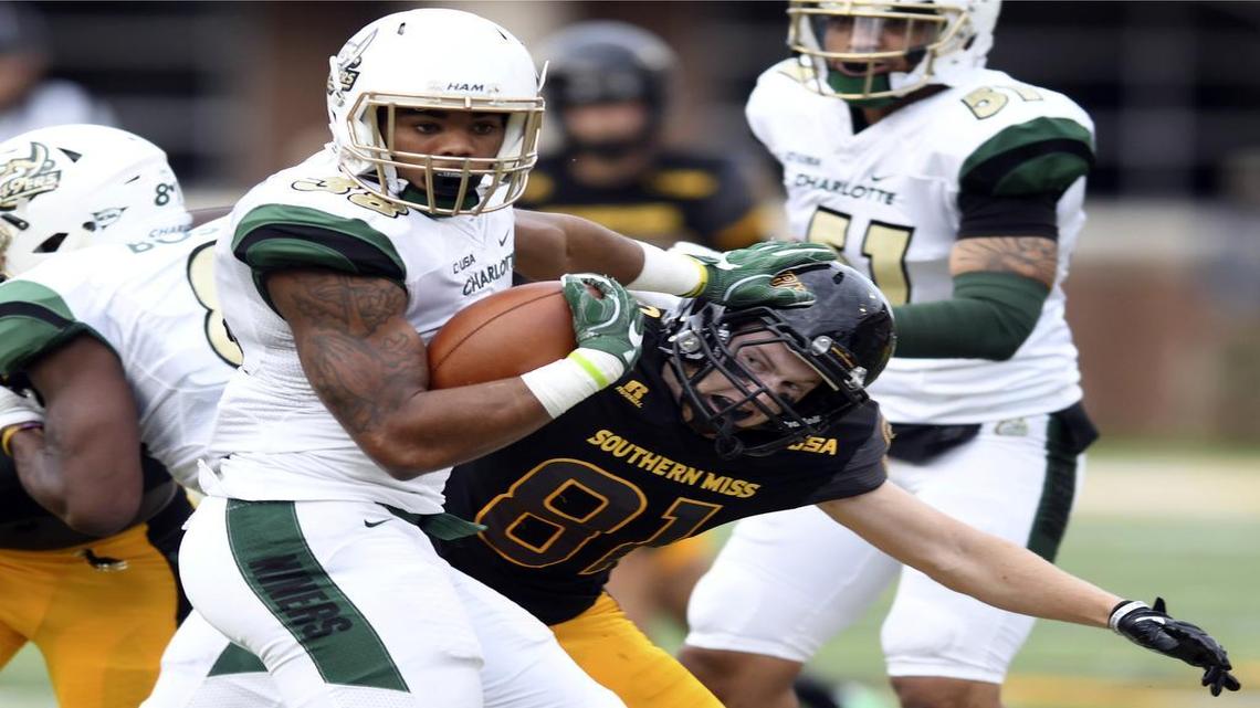 Charlotte running back Aaron McAllister carries the ball against Southern Mississippi during Saturday’s loss in Hattiesburg, Miss.