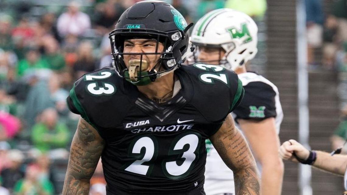 Charlotte 49ers defensive back Anthony Covington (23) celebrates after a third-down stop in Saturday’s game against the Marshall Thundering Herd at Richardson Stadium.