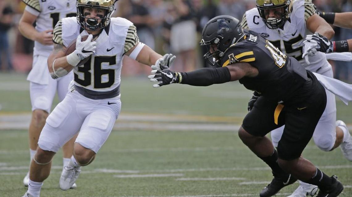Wake Forest running back Cade Carney (36) breaks free as Appalachian State linebacker Anthony Flory (44) defends during the first half of Saturday’s college football game in Boone. Wake Forest won 20-19.