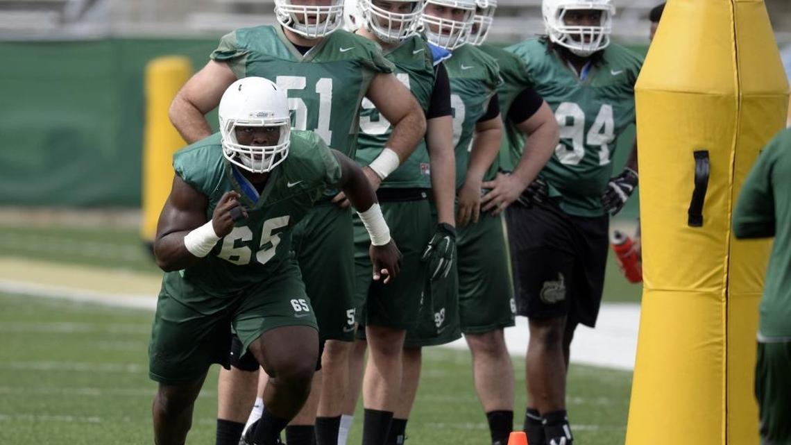 Charlotte 49er Larry Ogunjobi (65), shown during spring football practice in 2015, has developed into an NFL prospect.