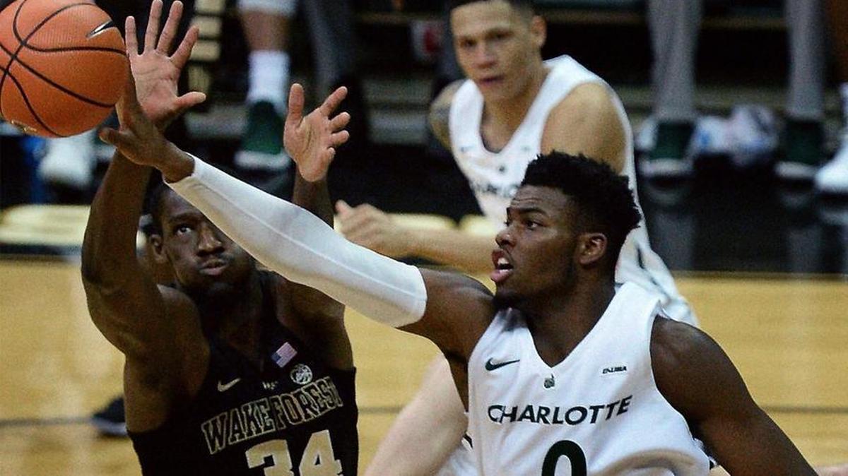 Wake Forest Deacons forward Sunday Okeke, left, and Charlotte 49ers center Jailan Haslem battle for control of a rebound in the first half of Tuesday’s game at Halton Arena.