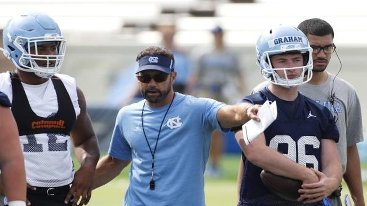 Head coach Larry Fedora directs the players as the UNC Tar Heels hold football practice at Kenan Stadium in Chapel Hill, NC on August 2, 2017.