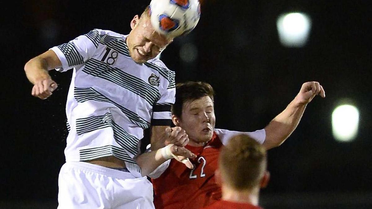 From left, Charlotte 49ers defender Luke Waechter goes up for a header with Radford's Sivert Daehlie during the first round of the NCAA men's soccer tournament played Thursday at UNC Charlotte's Transamerica Field. The 49ers won 2-1 and will play No. 1 seed Wake Forest on Sunday.