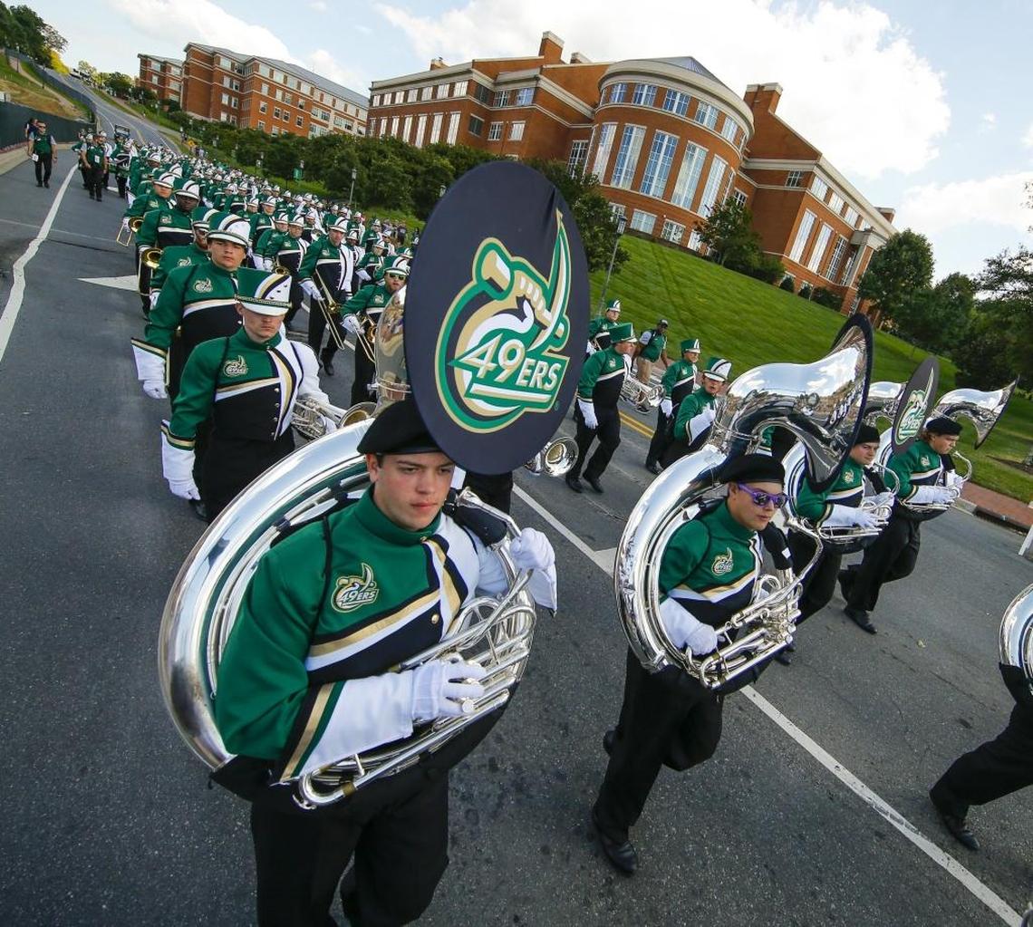 The Charlotte 49ers marching band winds its way through campus during the Niner Walk before the start of Saturday’s game against North Carolina A&T at Jerry Richardson Stadium.