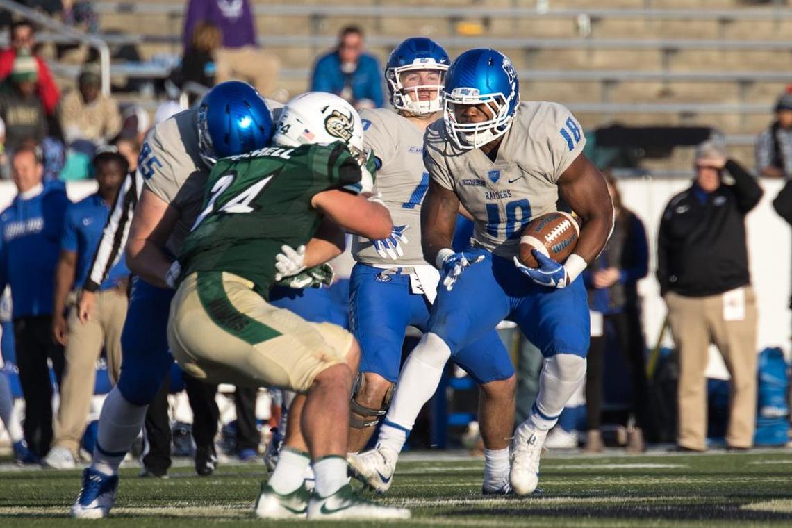 Middle Tennessee's Tavares Thomas (18) looks to get around a block for yardage during Saturday’s game against Charlotte at Richardson Stadium. Thomas finished with a game-high 195 rushing yards and two touchdowns.