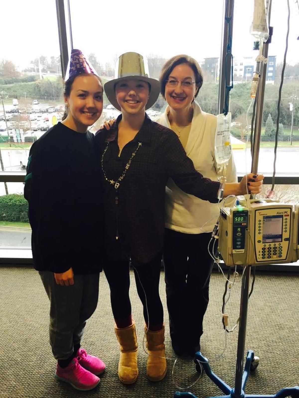 Alexandra Marshall with her sister Christina and her mother Lucia while getting her chemotherapy treatment on Dec. 31, 2015.