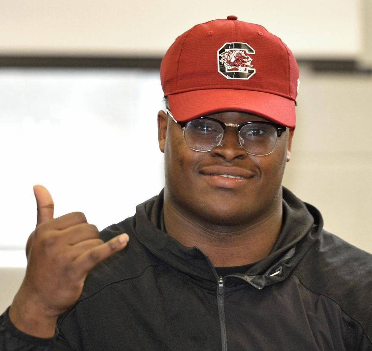 Concord High standout Rick Sandidge, a 6-foot-5, 288-pound defensive lineman, picked South Carolina over Georgia and North Carolina on Wednesday.