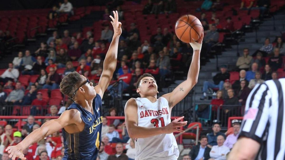 Davidson’s Kellan Grady (31) drives against La Salle's Miles Brookins (04) to score two of his game-high 26 points late in the second half of of Wednesday’s Atlantic 10 game at Belk Arena. The Wildcats won, 84-65.