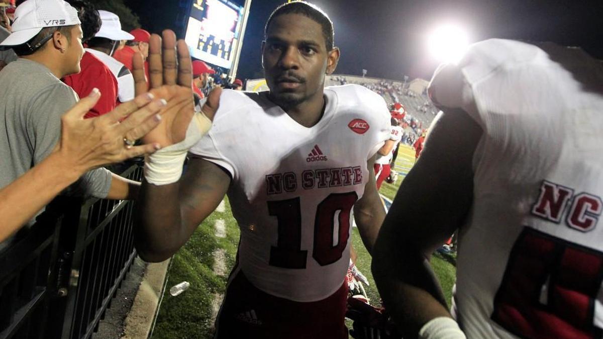 
N.C. State running back Shadrach Thornton (10) high-fives fans as he leaves the field after N.C. State's 38-14 victory over Old Dominion at S.B. Ballard Stadium in Norfolk, Va..

