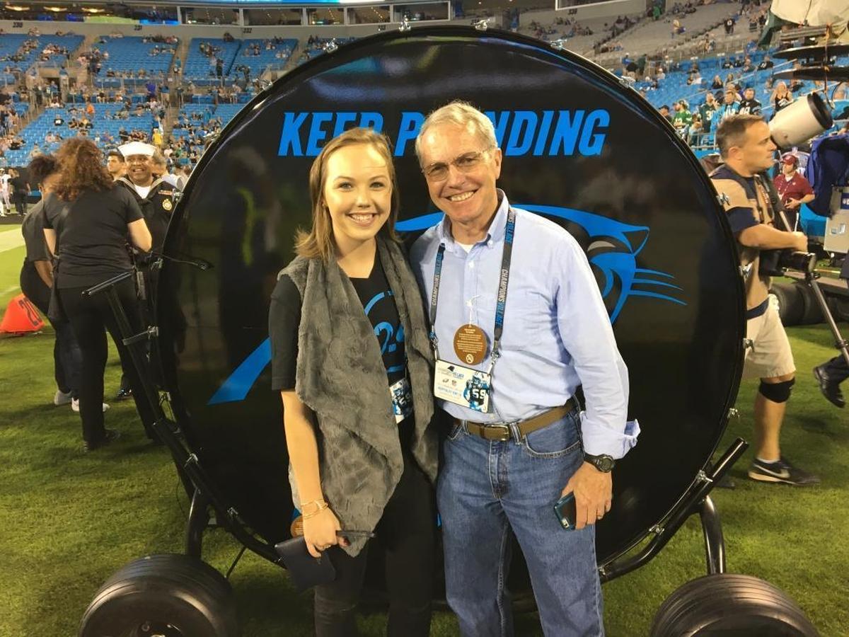 Alexandra Marshall with her father Greg at Bank of America Stadium last October, when she was invited by the Carolina Panthers to bang their Keep Pounding drum before a game.