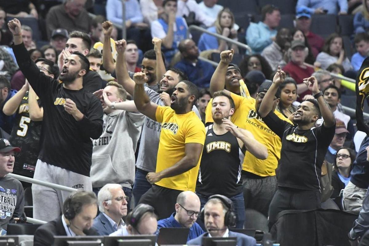 UMBC fans cheer their team during a break against Kansas State during Sunday’s second-round NCAA tournament game at the Spectrum Center.