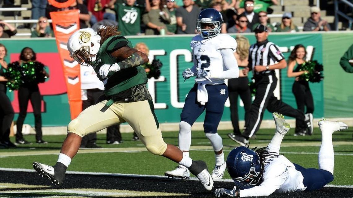 Charlotte 49ers running back Kalif Phillips scores his team’s first touchdown on a 14-yard run in Saturday’s Conference USA football game against Rice.