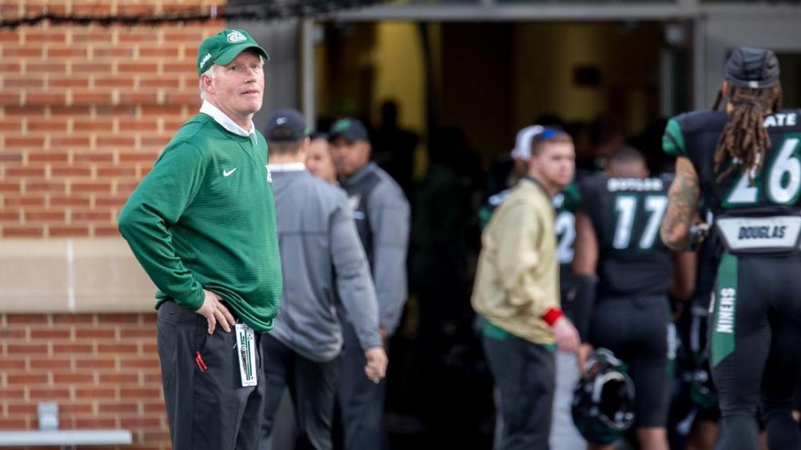 Charlotte coach Brad Lambert leaves the field at Richardson Stadium after Saturday’s 31-12 loss to Florida Atlantic. Lambert has compiled a 17-41 overall record since Charlotte started the football program five year ago.