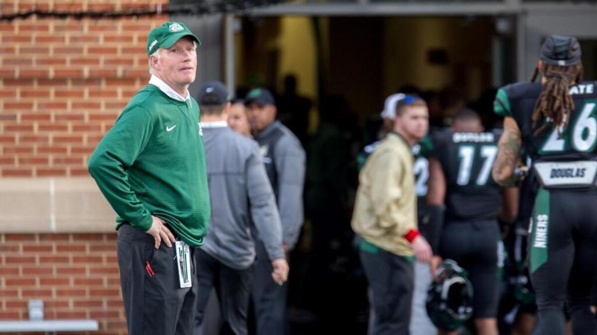 Charlotte coach Brad Lambert leaves the field at Richardson Stadium after Saturday’s 31-12 loss to Florida Atlantic. Lambert has compiled a 17-41 overall record since Charlotte started the football program five year ago.