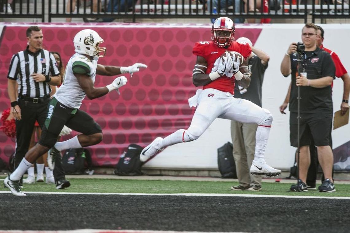 Western Kentucky tight end Mik’Quan Deane (85) catches a touchdown pass against Charlotte. The host Hilltoppers rolled up 627 yards in total offense in their 45-14 win on Saturday.