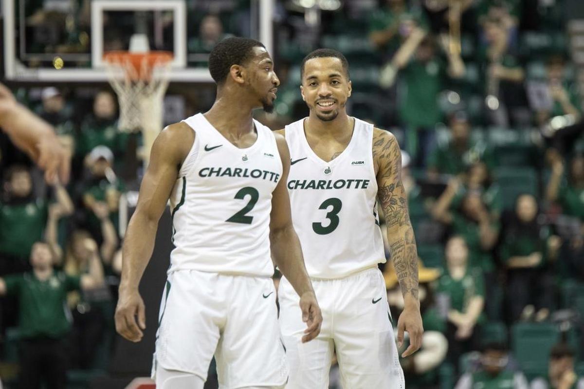 Andrien White, left, and Jon Davis combined for 65 of Charlotte's 83 points in Thursday’s 89-83 loss to Florida International at Halton Arena.