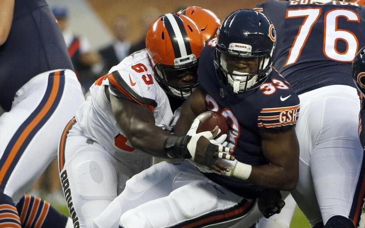 Cleveland Browns rookie defensive lineman Larry Ogunjobi, a former Charlotte 49ers standout, tackles Chicago Bears running back Jeremy Langford on Thursday, Aug. 31. Ogunjobi left Charlotte after setting 12 49ers defensive records.