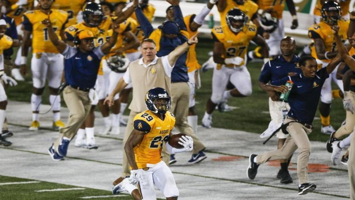 North Carolina A&T defensive back Mac McCain III runs to the end zone after an interception late in the fourth quarter against the Charlotte 49ers during Saturday’s game at Jerry Richardson Stadium.