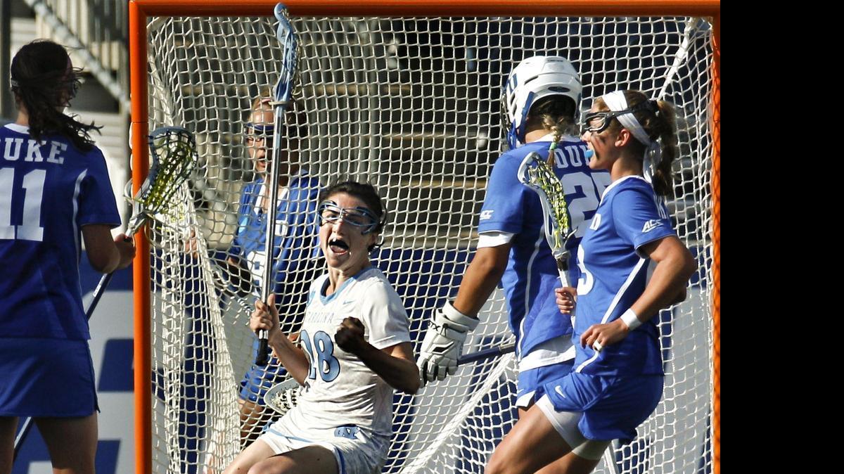 
North Carolina defender Courtney Waite, center, reacts to her goal on Duke goalie Kelsey Duryea, center right, during the first half of the semifinals in the NCAA Division I women’s lacrosse tournament Friday  in Chester, Pa. 

