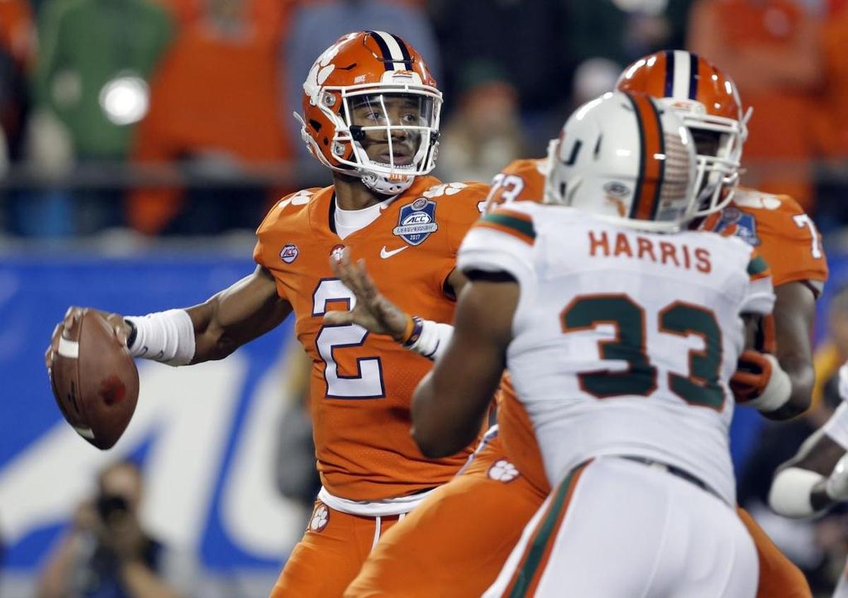 Clemson quarterback Kelly Bryant (2) looks to pass under pressure from Miami's Trent Harris (33) during the first half of the ACC Football Championship Game.