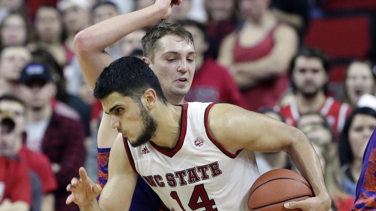 N.C. State’s Omer Yurtseven (14) and the Wolfpack will play host to No. 25 Miami on Sunday.