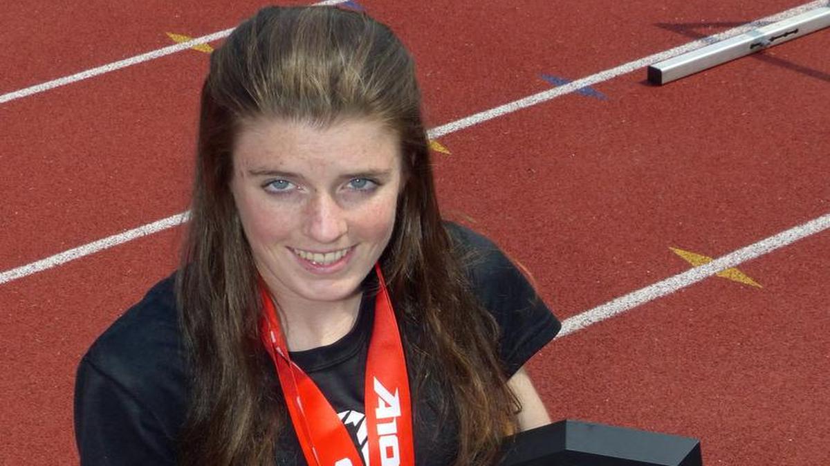 
Davidson senior Erin Osment wears the gold medals she won at the Atlantic 10 track and field championships May 3 in Fairfax, Va. Osment capped her college career by winning the women's 5,000- and 10,000-meter runs at the A-10 championships. She was also named the A-10's women's track performer of the year. 
