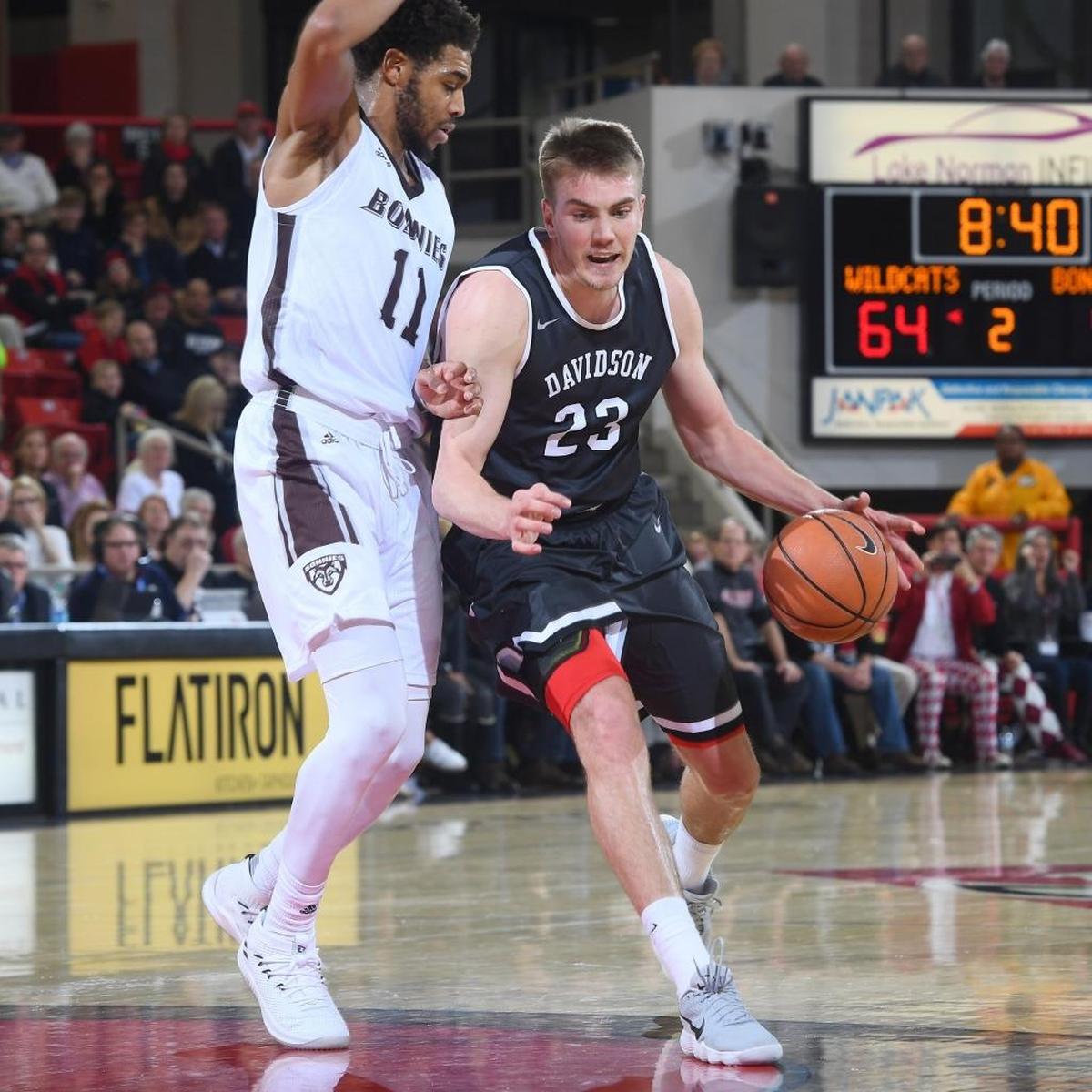 Davidson’s Peyton Aldridge (23) drives past St. Bonaventure’s Courtney Stockard (11) during Friday’s game at Belk Arena. Aldridge finished with a game-high 25 points as Davidson won 83-73.