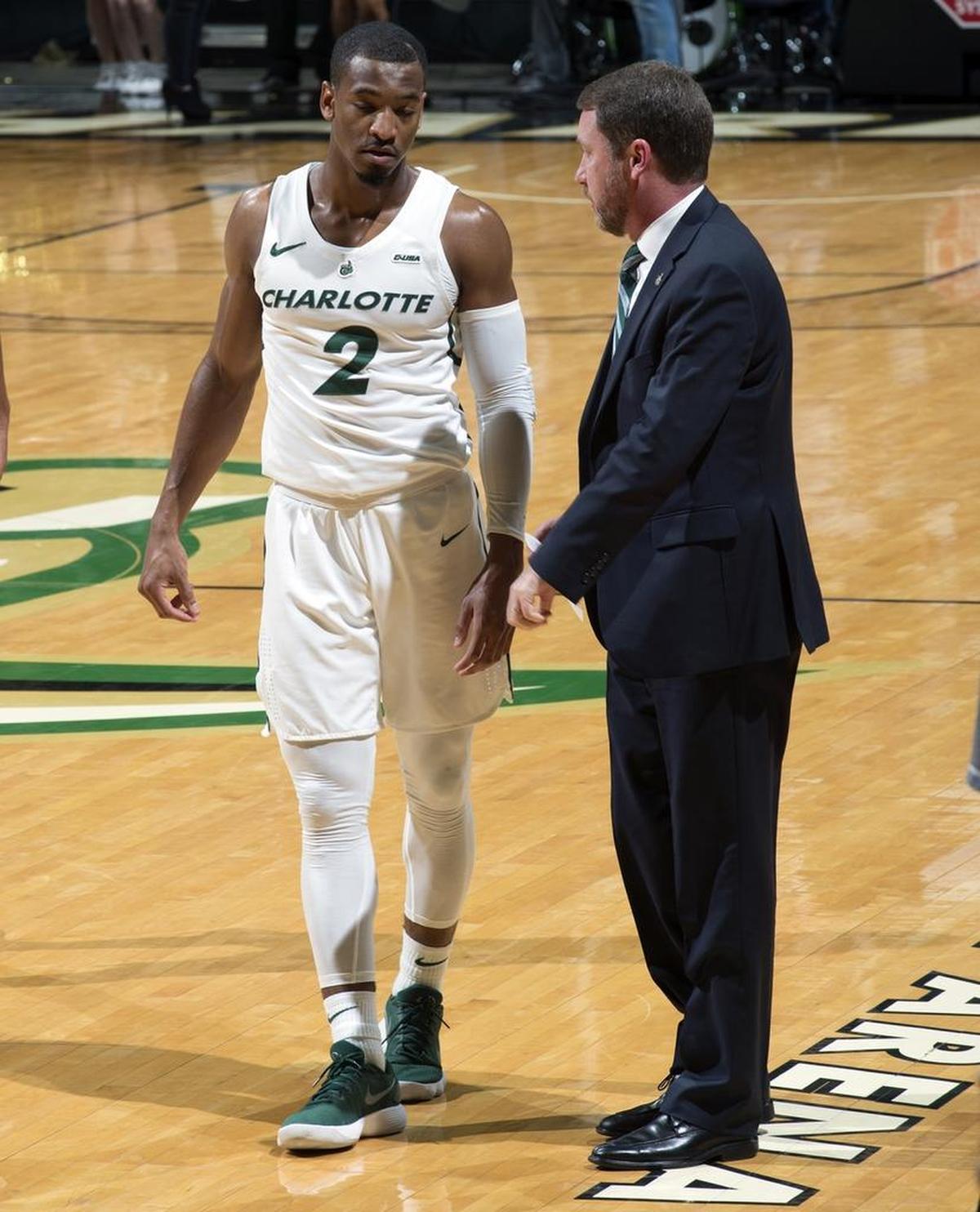 Charlotte 49ers guard Andrien White, left, said he endorses the changes interim coach Houston Fancher has made.