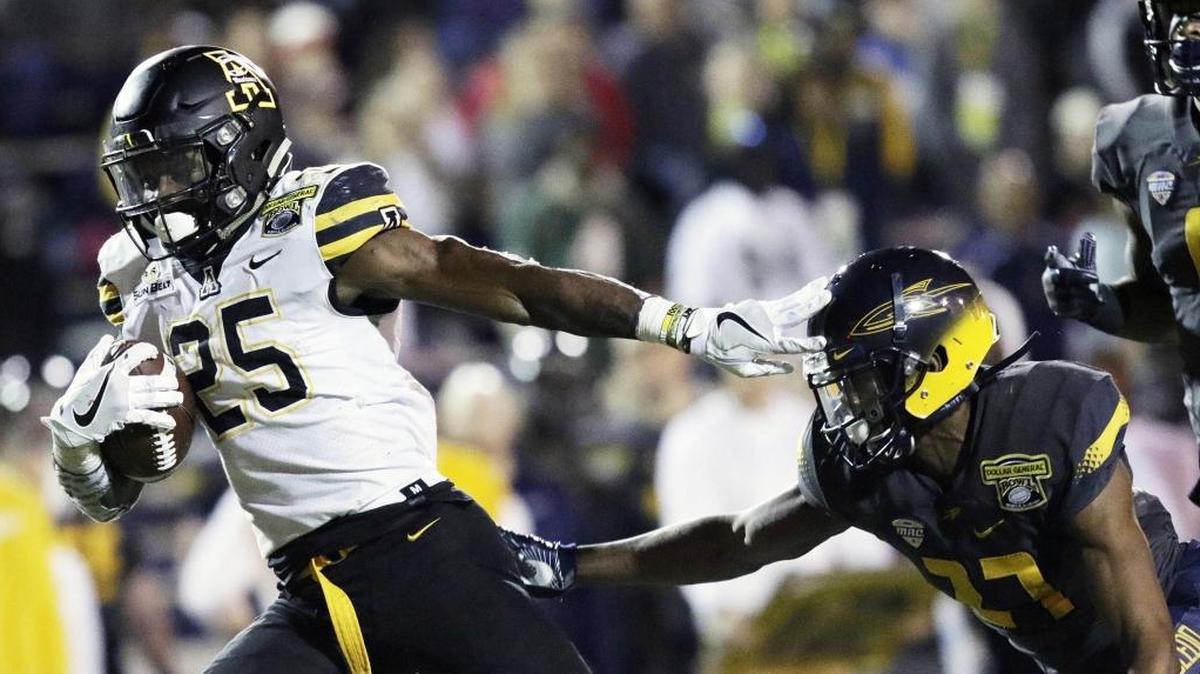 Appalachian State running back Jalin Moore (25), who played high school ball at Shelby Crest, wasn’t particularly big or fast growing up, but he was always strong. He’s refined that strength to be one of college football’s top returning rushers.