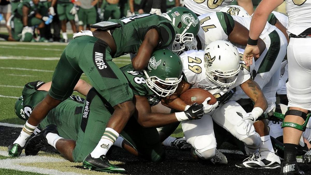 Charlotte 49ers redshirt sophomore running back Akease Rankin (29) scores a touchdown during Saturday’s spring football game at Richardson Stadium.