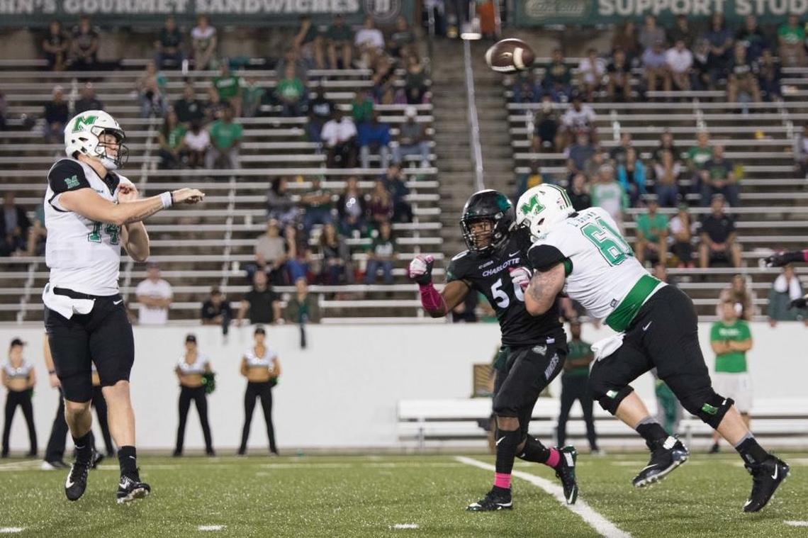 Charlotte linebacker Karrington King (50) forces the throwaway from Marshall quarterback Chase Litton during Saturday’s game at Jerry Richardson Stadium. The 49ers fell 14-3, their ninth straight loss going back to last season.