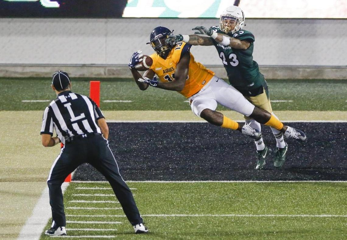 North Carolina A&T wide receiver Elijah Bell (13) grabs a pass near the end zone while being covered by Charlotte 49ers Anthony Covington (23) during Saturday’s game at Jerry Richardson Stadium.