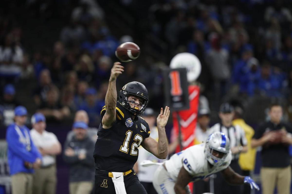 Appalachian State quarterback Zac Thomas (12) completed 15 passes for 177 yards, three touchdowns and caught a scoring pass in the Mountaineers’ 45-13 victory against Middle Tennessee in the New Orleans Bowl on Saturday.