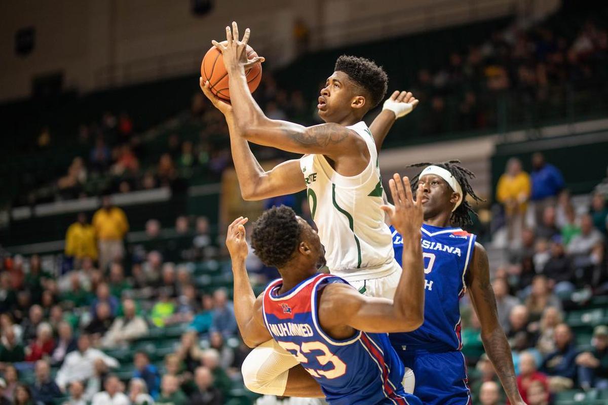 Charlotte 49ers freshman Dravon Mangum commits a charge against Louisiana Tech defender Mo Muhammed in Saturday’s Conference USA men’s basketball game at Halton Arena. Charlotte won 55-40.