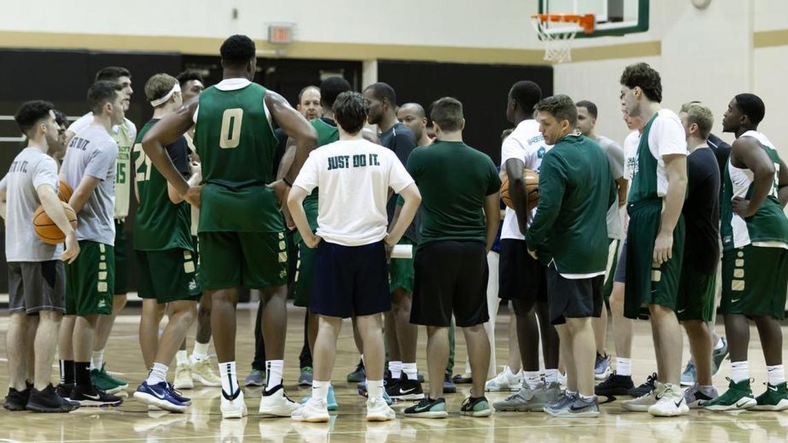 First-year men’s basketball coach Ron Sanchez, center, gives instructions to his team during the Charlotte 49ers’ first preseason practice. Tuesday, Charlotte will play host to Chattanooga in its season opener at Halton Arena.