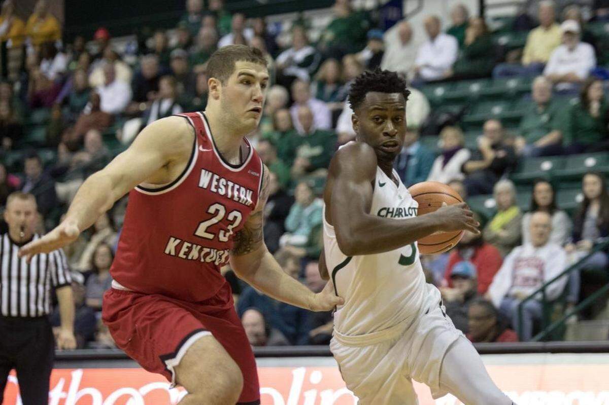 Charlotte 49ers guard Austin Ajukwa, right, finished with 14 points at Florida Atlantic on Thursday.
