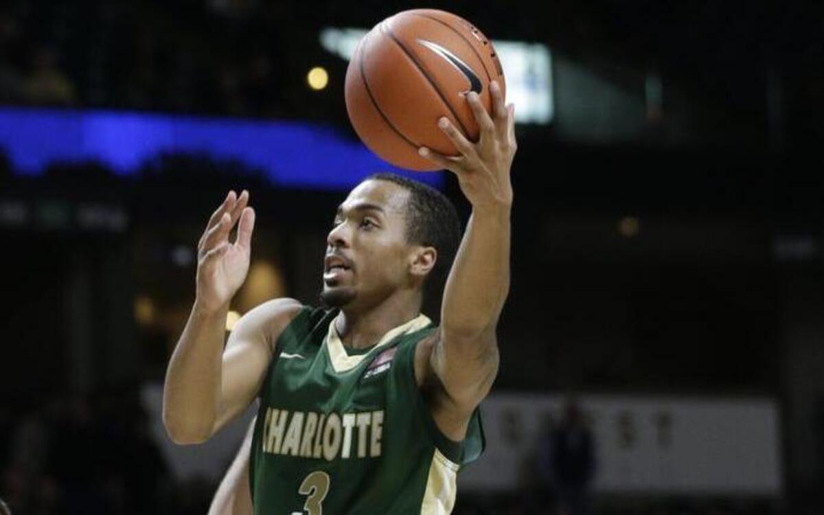 Charlotte 49ers point guard Jon Davis (3) found an option in coach Mark Price, and the 49ers found a leader in Davis.
