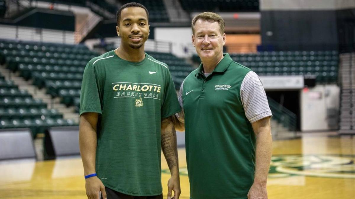 Junior Jon Davis (left) is entering his third season as the starting point guard for the Charlotte 49ers and Mark Price (right), the team’s third-year coach and former NBA All-Star.