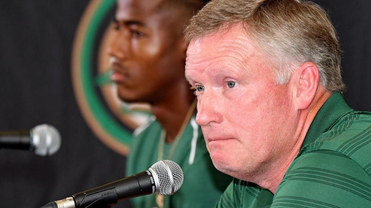 Charlotte 49ers coach Brad Lambert, right, and senior receiver Austin Duke take questions from the media during the 49ers’ first weekly football news conference Tuesday. Charlotte will open its season Thursday night at No. 19 Louisville.
